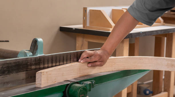 istock carpenter - craftsman applying wood bending technique 2193475570