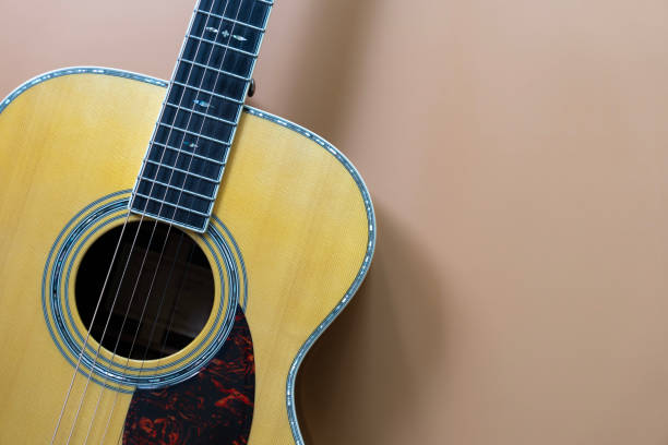 istock old acoustic guitar on brown table background, music concept 2193479648