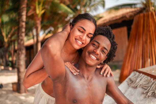 Joyful Diverse Couple Enjoying Tropical Beach Getaway