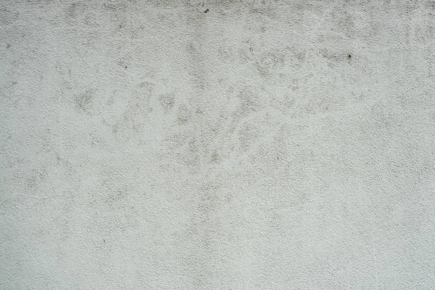 A weathered concrete surface showcasing textured and rugged details