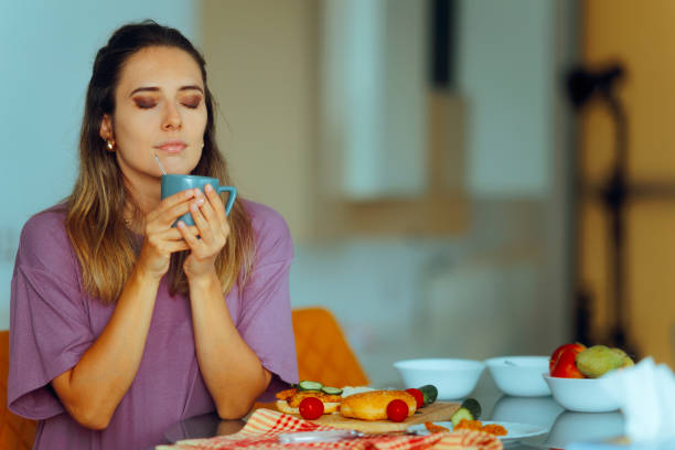 istock Happy Woman Having Breakfast and Morning Coffee 2193488162