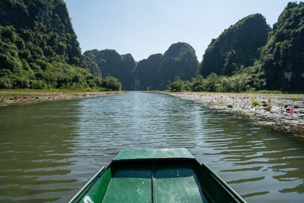 It is a popular tourist destination in northern Vietnam and part of the UNESCO World Heritage-listed Trang An Landscape Complex, near Tam Coc village in Ninh Binh province. One of the flooded cave karst systems is Tam Coc.