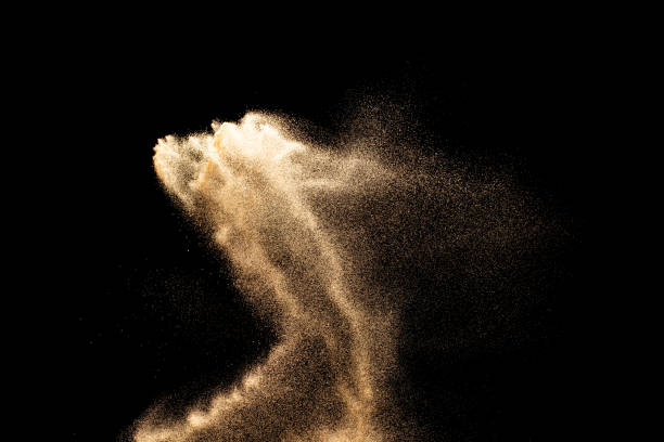 istock Sand explosion isolated on black background. Freeze motion of sandy dust splash. 2193492653