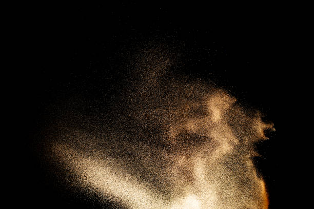 istock Sand explosion isolated on black background. Freeze motion of sandy dust splash. 2193492655
