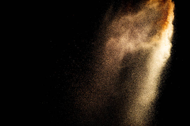 istock Sand explosion isolated on black background. Freeze motion of sandy dust splash. 2193492657