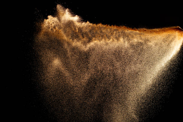 istock Sand explosion isolated on black background. Freeze motion of sandy dust splash. 2193492669
