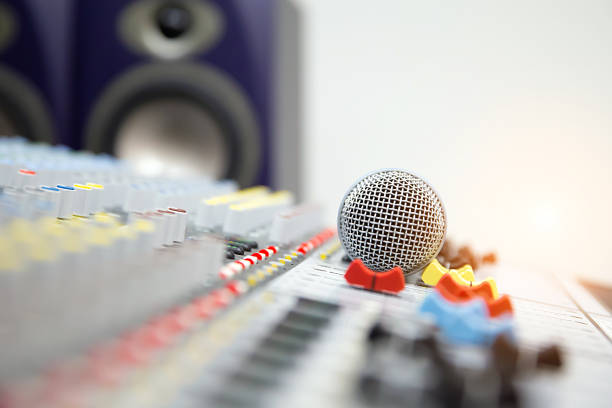 istock Microphone on the sound mixer in the studio for recording, editing, and Sound system control concept. 2193495532