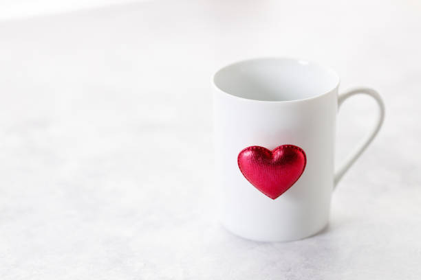istock White tea or coffee cups with red heart. 2193499008