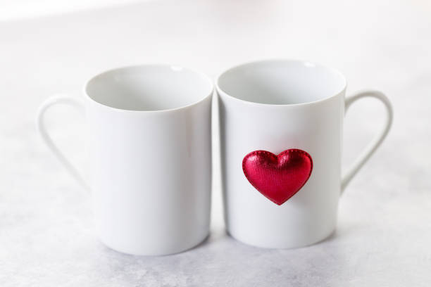 istock White tea or coffee cups with red heart. 2193499020