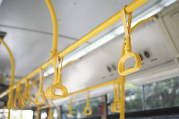 A row of yellow handle on a bus. High quality photo