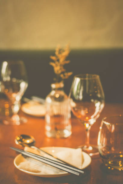 glassware and tableware and curlery for chinese food on a table