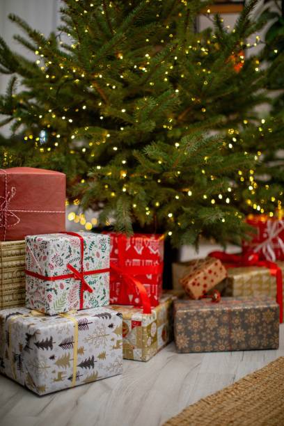 istock A beautifully decorated Christmas tree with colorful presents awaits excitement 2193504271