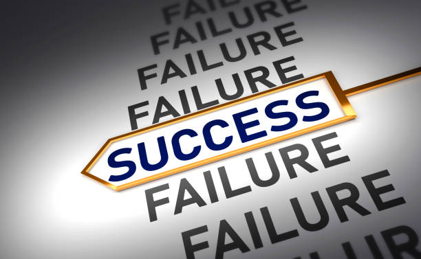Clock hands stop at word success in the middle of word failure. Concept of learning from failure or wrong ideas to succeed in work and business.