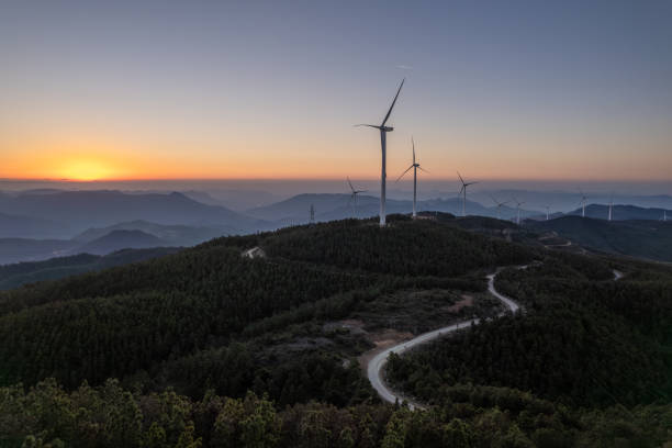 Wind turbines on top of a mountain at sunrise