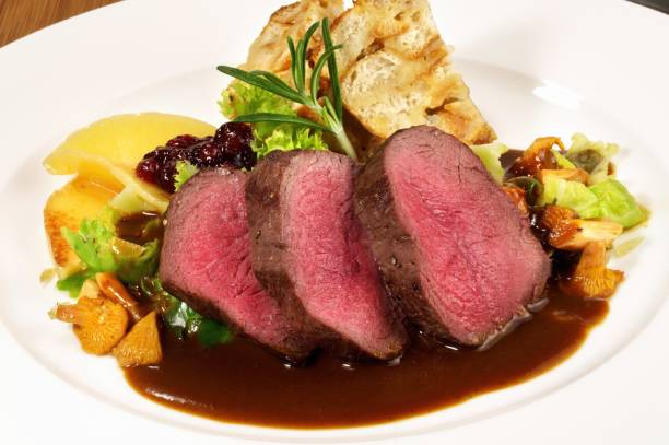 Deer with Vegetables on Cranberry Sauce
