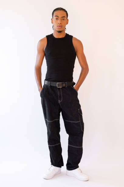 istock Handsome male standing with hands in pockets 2193507400