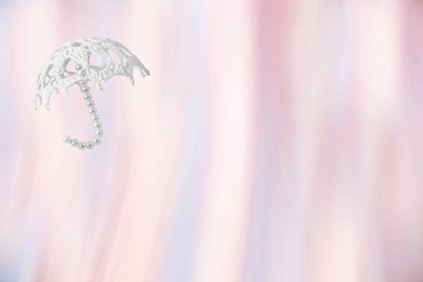 Studio shot of a young woman in angel wings isolated on white