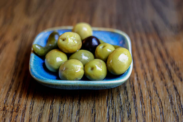 A bowl of olives and pickles. Spanish tapas. Space for text.
