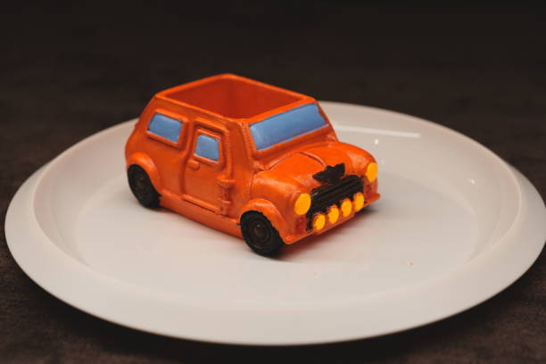 Izmir, Turkey - June 01, 2015.  Mini Cooper S Toy car on white background and checked floor.