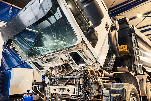 istock Crashed truck with crashed and demolished windshield at repair center with no people. 2193515739