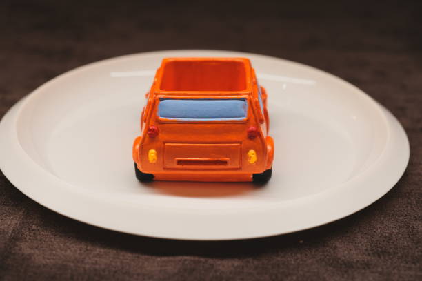 istock A Colorful Toy Car Placed on a Plate An Engaging and Creative Concept Displaying Playfulness 2193516281