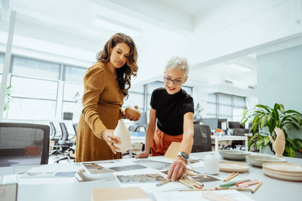 istock Creative female entrepreneurs working in creative office with pottery and interior design solutions 2193516621