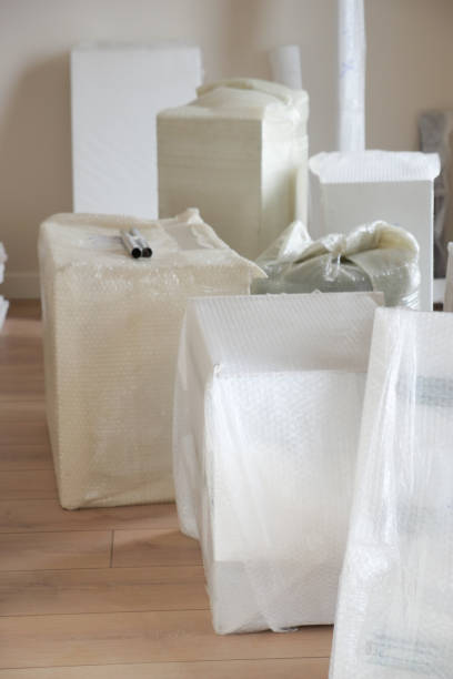 istock An empty room with hardwood flooring and wrapped in plastic. 2193517711