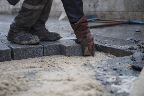 istock Laying Paving Stones on a Construction Site for a driveway or footpath requires skill and precision 2193517870