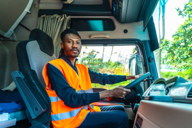 istock African driver with reflective clothes sitting in a truck 2193517997