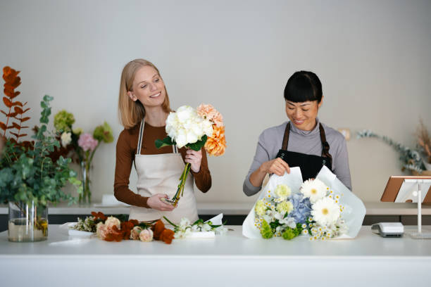 Florists Creating Beautiful Bouquets in a Modern Flower Shop