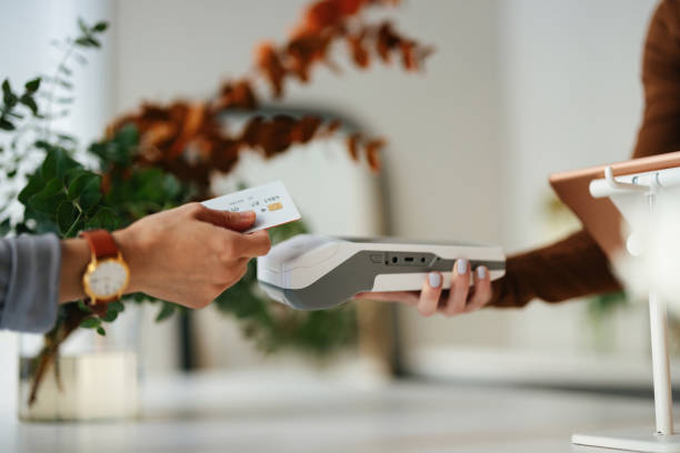 istock Hand Paying for Purchase with Card Payment in Modern Shop Setting 2193518226