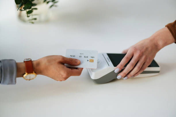 istock Contactless Payment Transaction in Modern Retail Store with Flower Display 2193518229