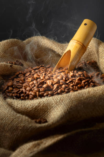 istock Fresh roasted coffee beans in burlap bag. 2193520416