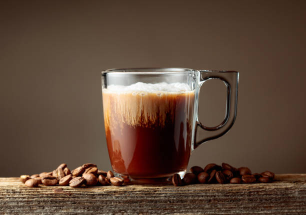 istock Coffee and chocolate drink with cream on a brown background. 2193520455