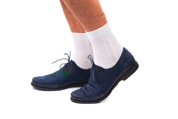 istock men's shoes on feet isolated 2193521281