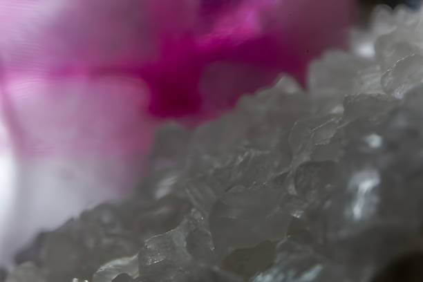 istock Macro close up of coarse salt crystals with pink light 2193522887