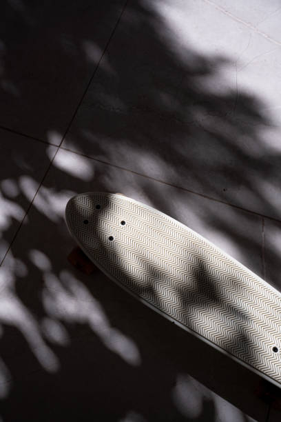 istock Skateboard details on shadowy ground, colorful wheel, pattern 2193526384