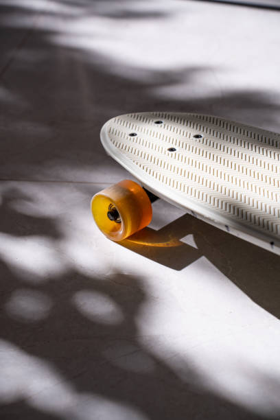 istock Skateboard details on shadowy ground, colorful wheel, pattern 2193526388