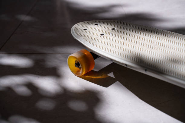 istock Skateboard details on shadowy ground, colorful wheel, pattern 2193526762