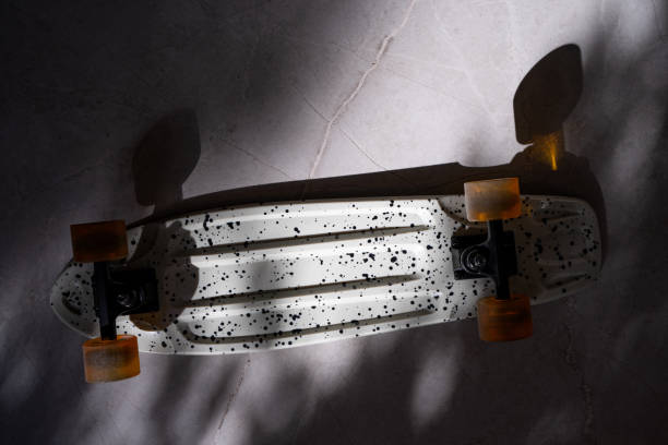 istock Skateboard details on shadowy ground, colorful wheel, pattern 2193527008