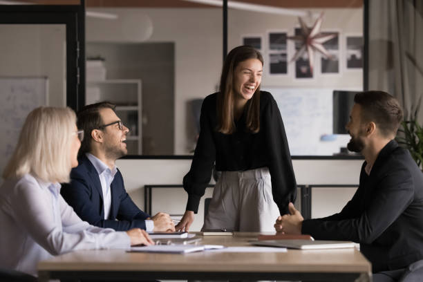 istock Laughing businesspeople take part in briefing with teammates 2193527215