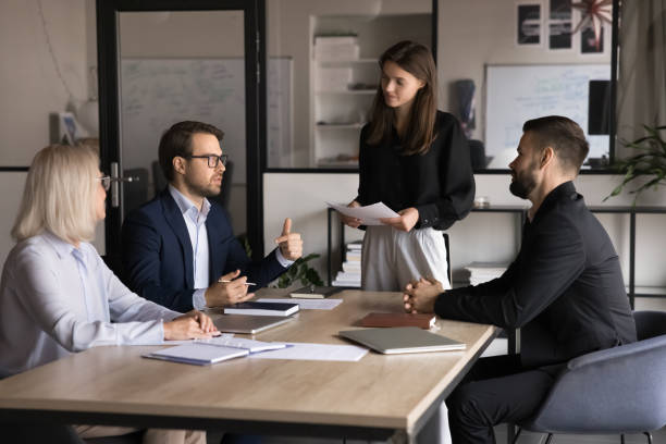 istock Group of four businesspeople discussing work-related matters 2193528711