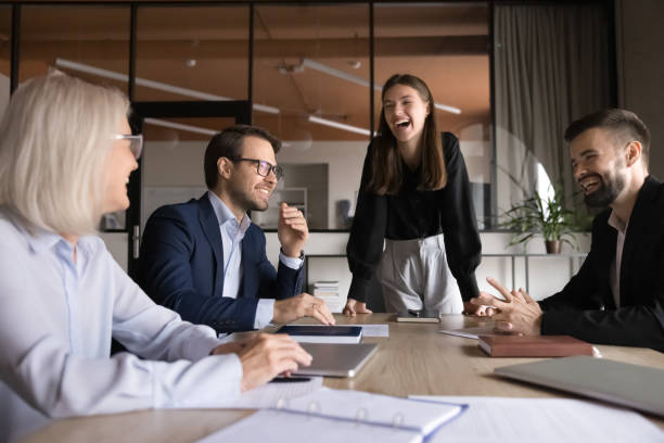 istock Happy business colleagues, employees working together on joint project 2193529647