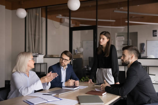 istock Businesswoman explaining project details, clarifying terms for contract during briefing 2193530230
