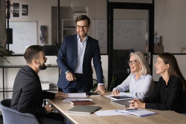 istock Happy team laughing, lead talk in light-hearted and positive atmosphere 2193531570