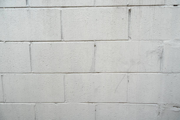 istock A textured brick wall showcasing its rustic surface, ideal for use in design as a grunge wallpaper or vintage background 2193534042