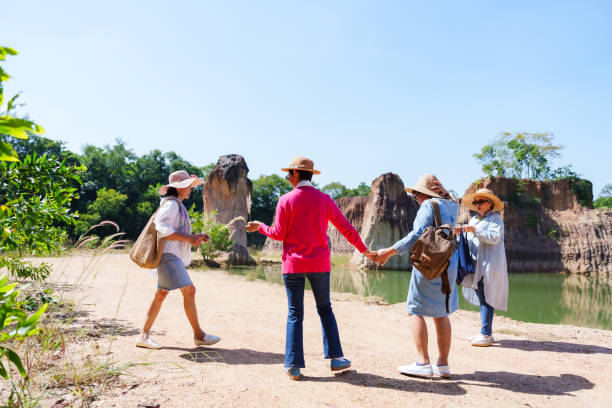istock Senior women walking cheerfully near scenic rock formations and greenery, enjoying time together, reflecting happiness, freedom, and the joys of retirement and leisure. 2193534310