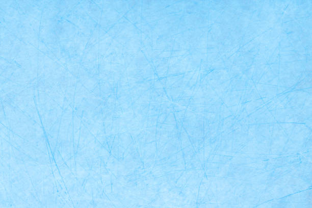 istock Icy blue background with ice skating tracks. 2193534477