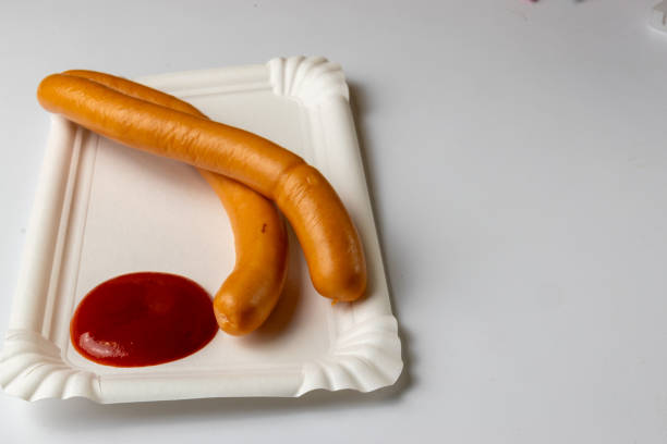 istock Boiled sausage on a paper plate 2193538120