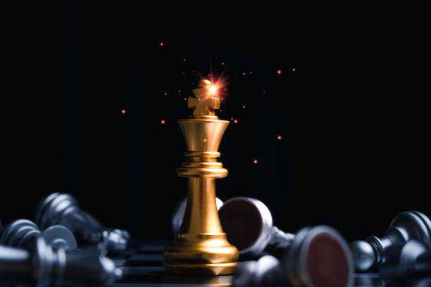 istock Golden king chess encounter with silver chess enemy on dark background for strategy idea of winner concept 2193538743